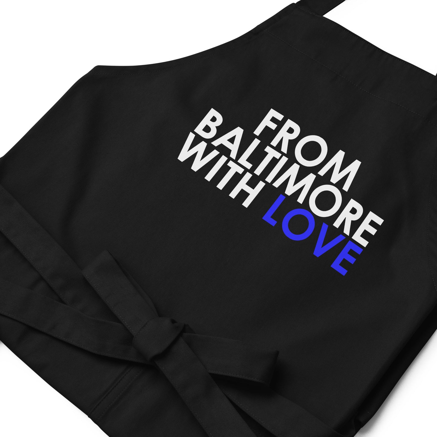 Blue cotton apron by From Baltimore With Love™ with adjustable neck strap and front pockets, perfect for cooking or baking.
