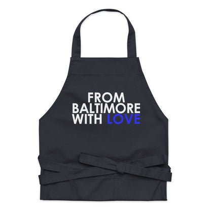 Blue cotton apron by From Baltimore With Love™, featuring a comfortable fit and practical design for cooking or baking.