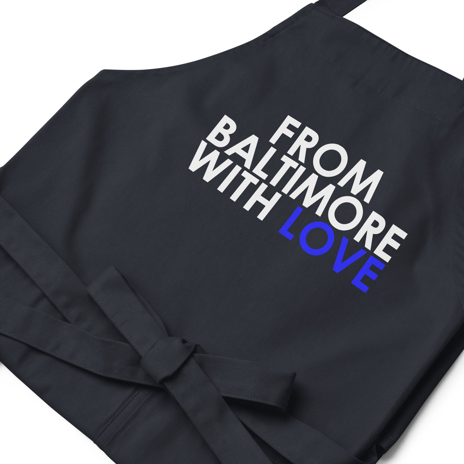 Blue cotton apron by From Baltimore With Love™, featuring adjustable neck strap and front pockets for cooking or gardening.