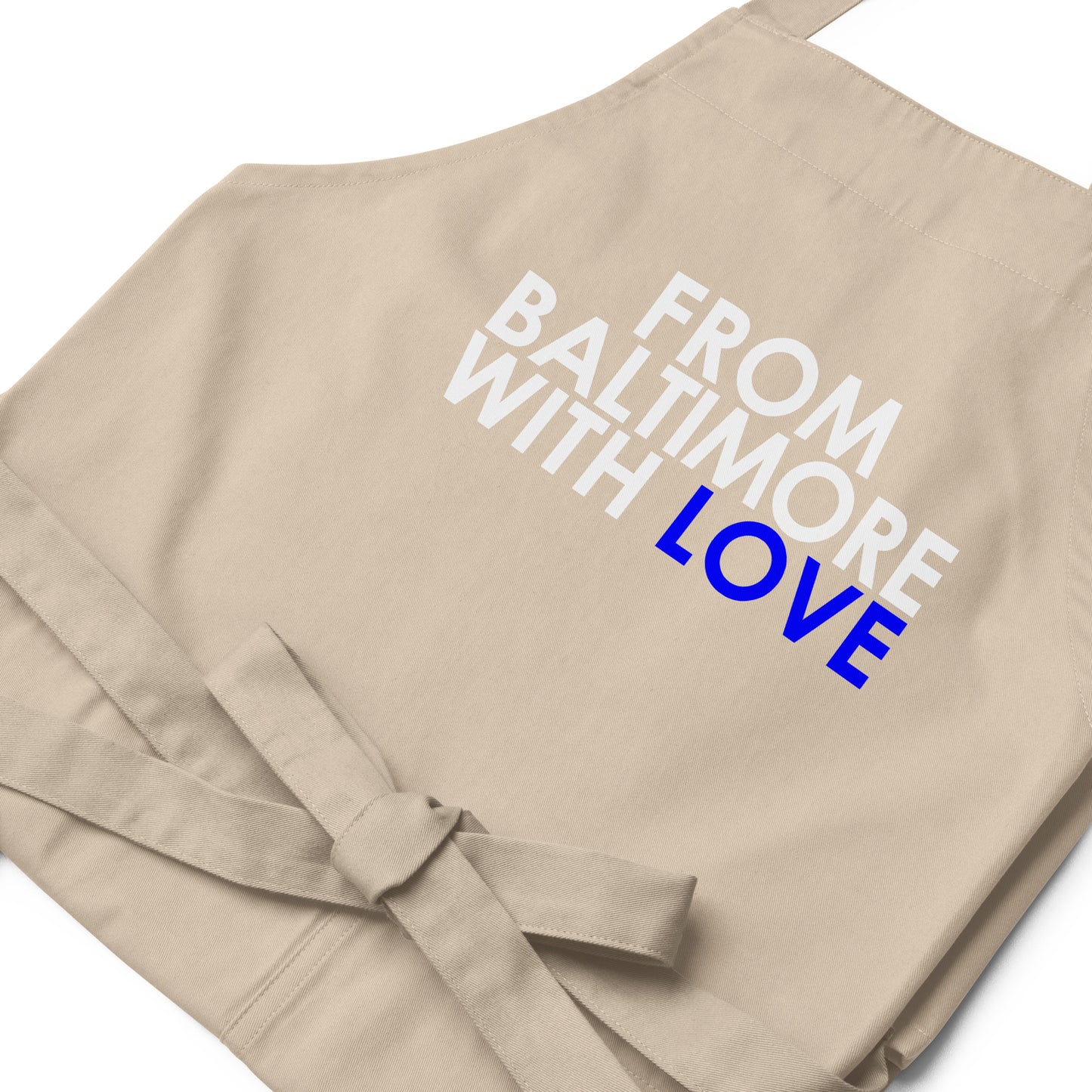 Blue cotton apron by From Baltimore With Love™ with adjustable neck strap and front pockets for cooking or baking.