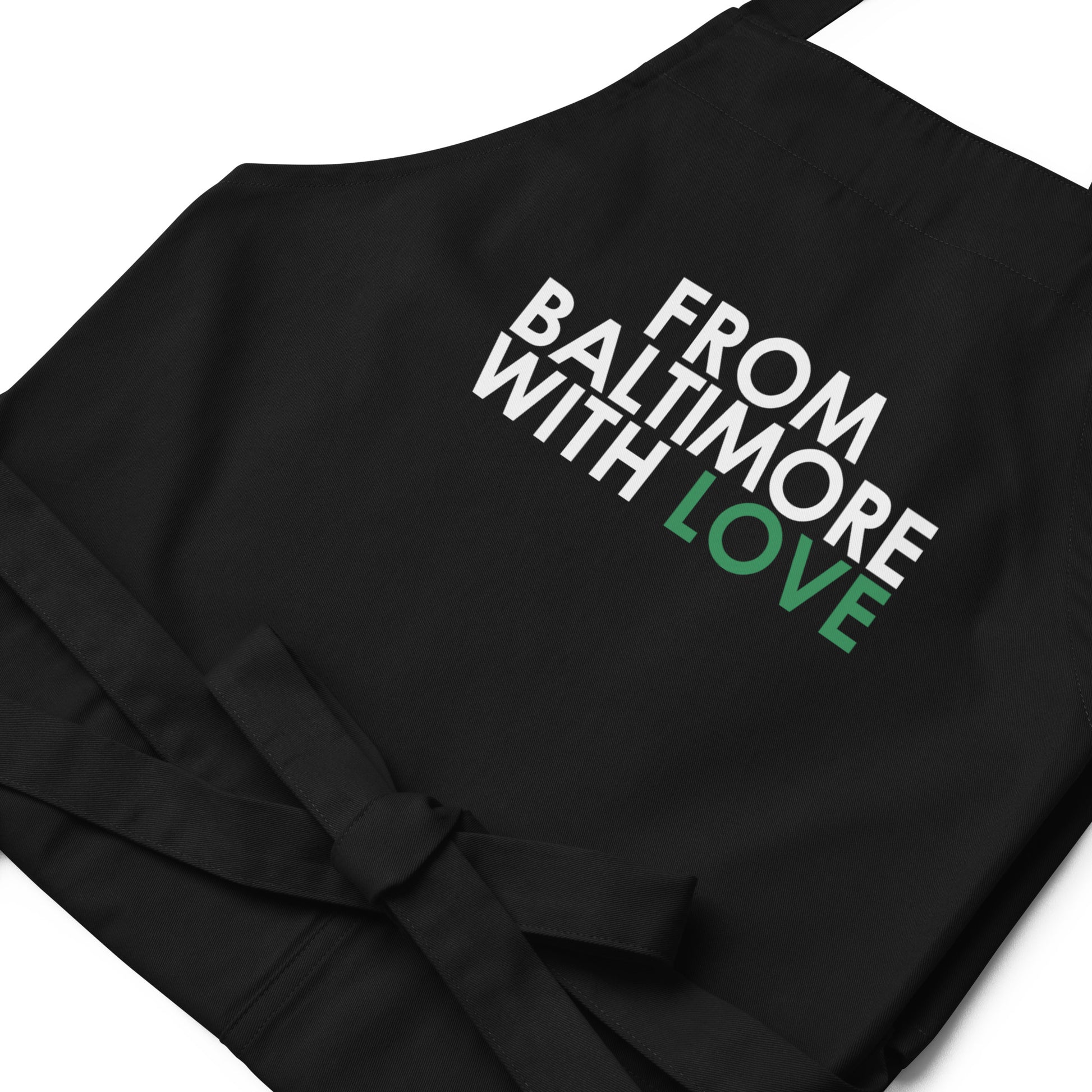 Green cotton apron by From Baltimore With Love™ featuring a classic design, perfect for cooking or crafting activities.