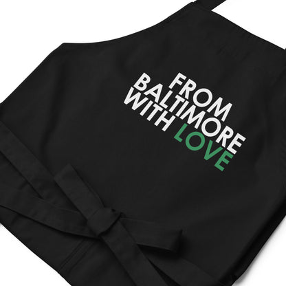 Green cotton apron by From Baltimore With Love™ featuring a classic design, perfect for cooking or crafting activities.