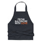 Orange cotton apron from Baltimore With Love™ featuring black accents, durable for cooking and baking activities.
