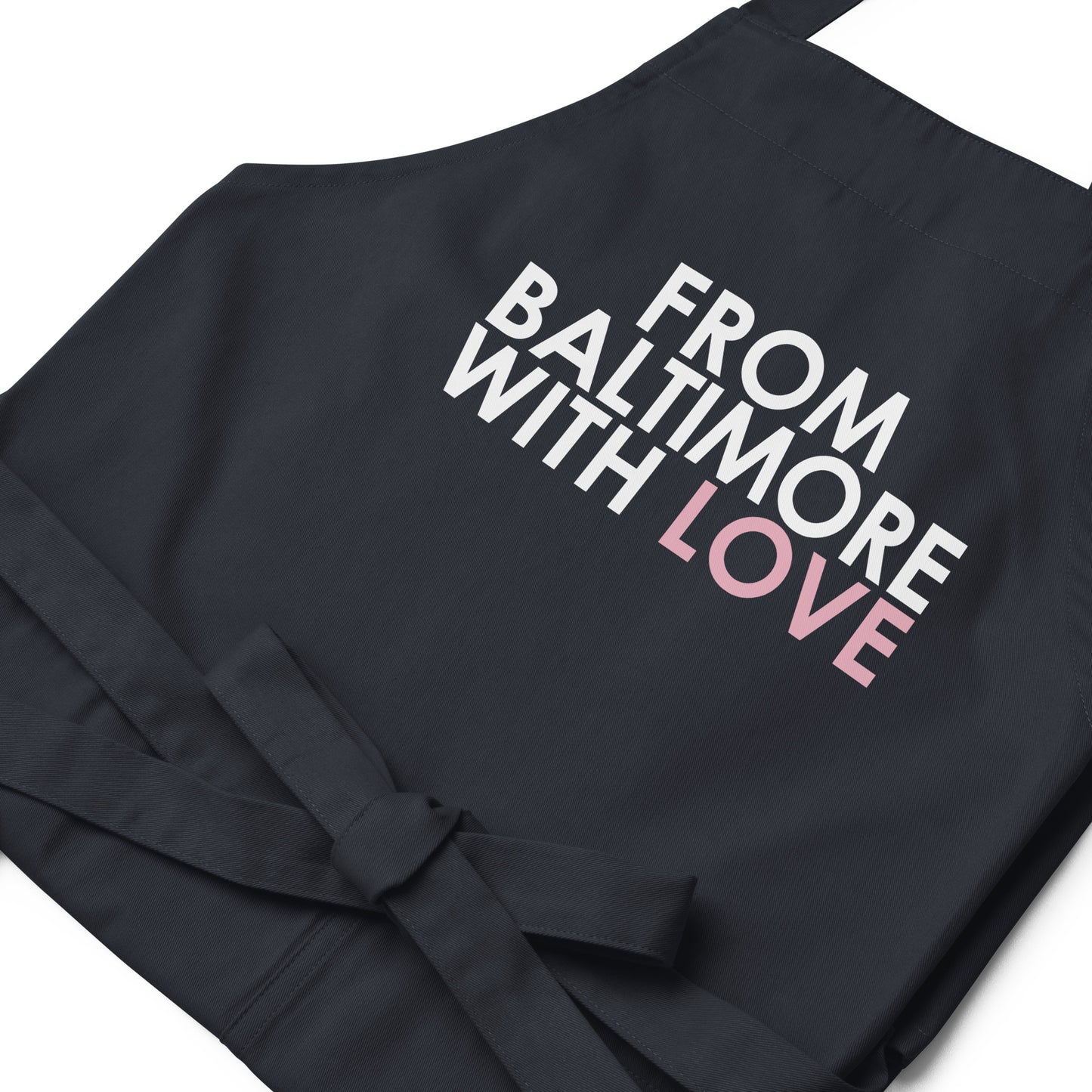 Pink cotton apron by From Baltimore With Love™ featuring a classic design, ideal for cooking or crafting activities.