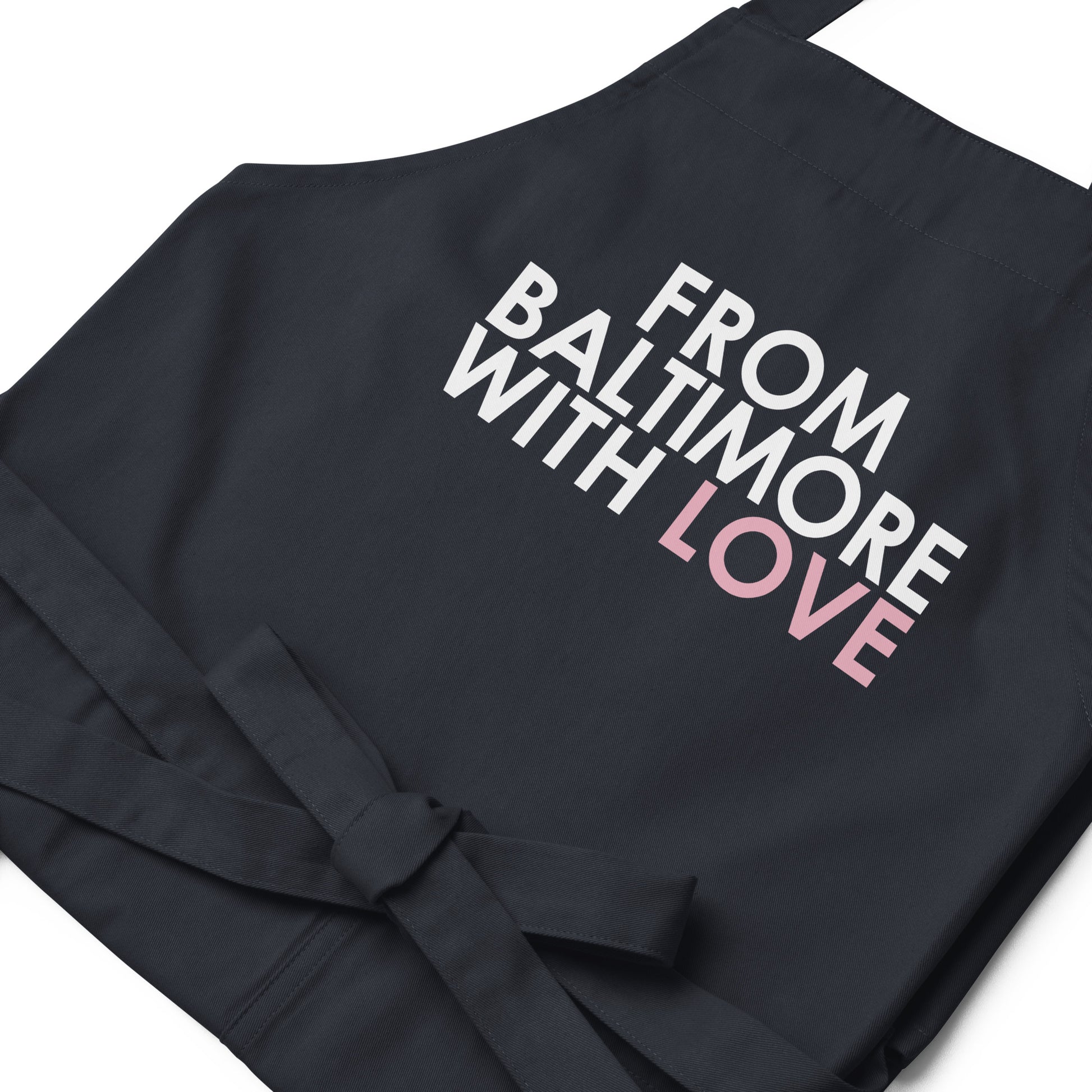 Pink cotton apron by From Baltimore With Love™ featuring a classic design, ideal for cooking or crafting activities.