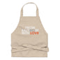 Black organic cotton apron by From Baltimore With Love™ with adjustable neck strap and front pockets.