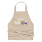 Black FBWL MO Love organic cotton apron by From Baltimore With Love™ shown on a person in a kitchen setting.