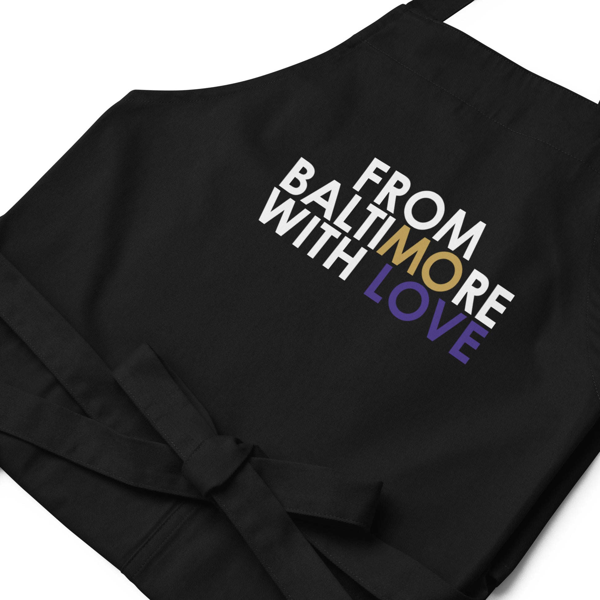 Black FBWL MO Love organic cotton apron by From Baltimore With Love™, featuring a durable cotton fabric and adjustable neck strap.
