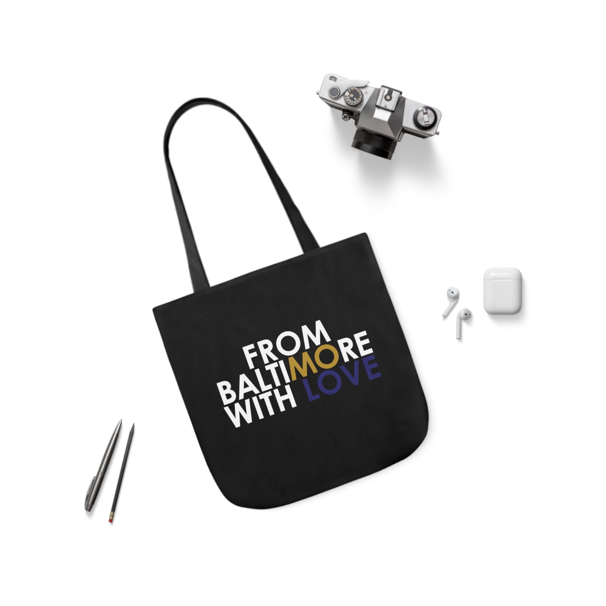 Black tote bag with gold and purple accents, stylish accessories by Printify, showcasing the spacious design and vibrant details.