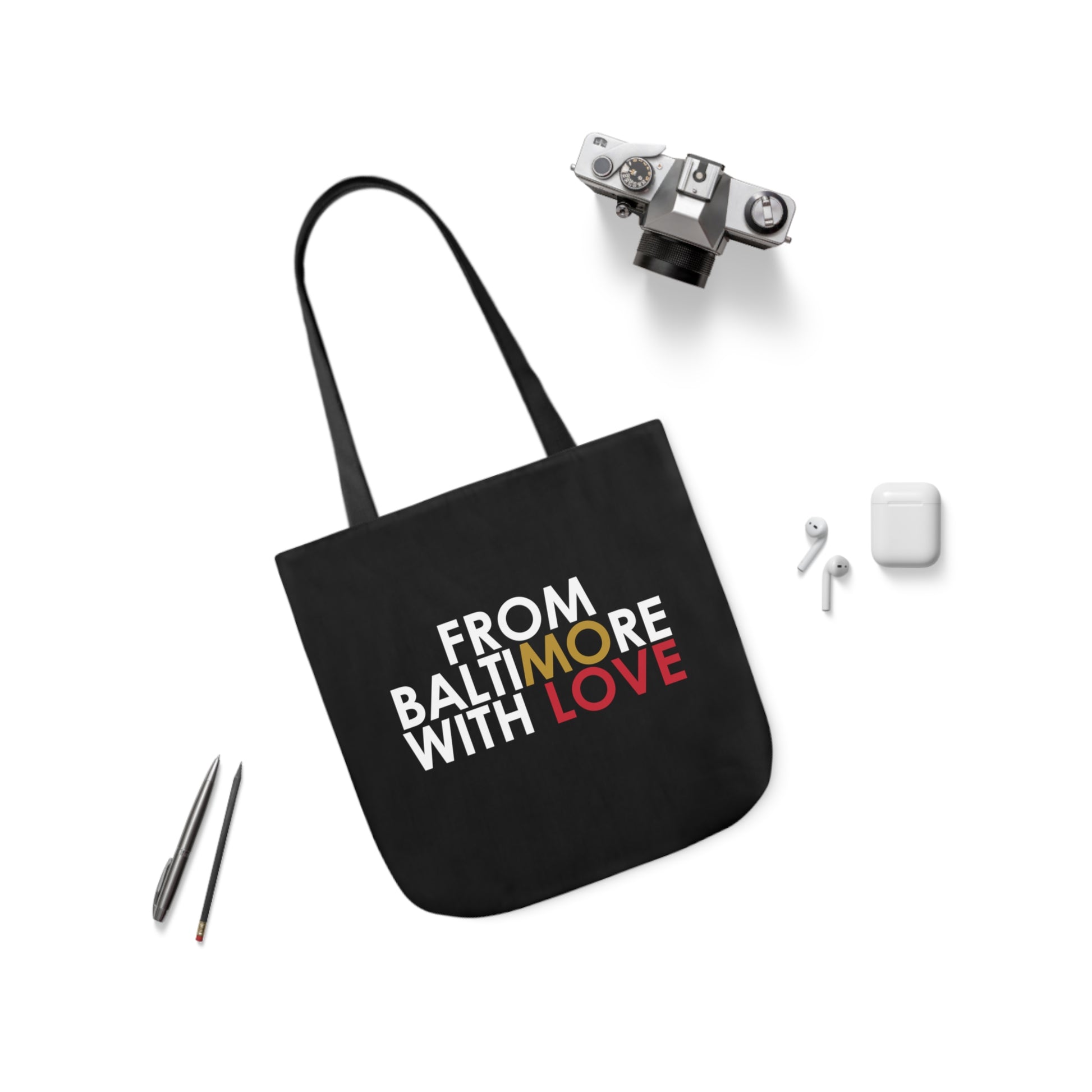 Black tote bag with gold and red accents, stylish accessories by Printify, featuring spacious design and durable material.